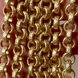This Lovely Satin Gold Textured Chain is 6.3mm.  Priced By The Foot.   839