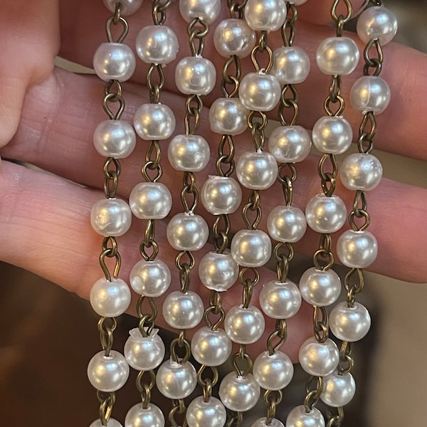 6.4mm, White With a Slight Gray Hue. Glass Pearls. With Antiqued Brass Wire. Priced By the Foot.   LB 3