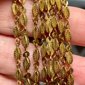 Raw Brass. Unplated Brass 3-Dimensional Sparkle Chain. Soft, Gold Brass Color. 3.8wide 9.2 long Priced by the foot