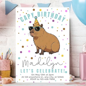 May include: A white birthday invitation with a cartoon capybara wearing sunglasses and a party hat. The text reads "CAPY BIRTHDAY Madelyn LET'S CELEBRATE!" with event details. Colorful confetti dots the background.
