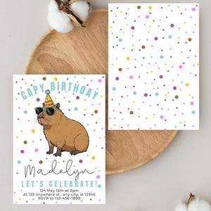May include: A birthday invitation featuring a cartoon capybara wearing sunglasses and a party hat. The invitation has the text "CAPY BIRTHDAY" and "Madelyn, LET'S CELEBRATE!" with event details and RSVP information. The background is white with colorful polka dots.