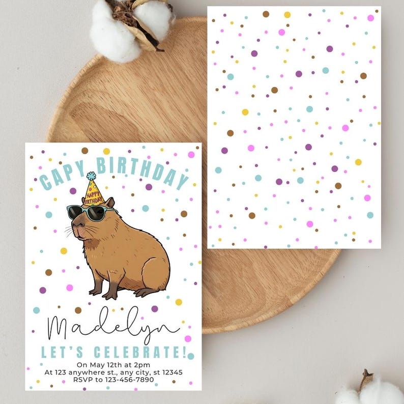 May include: A birthday invitation featuring a cartoon capybara wearing sunglasses and a party hat. The invitation has the text "CAPY BIRTHDAY" and "Madelyn, LET'S CELEBRATE!" with event details and RSVP information. The background is white with colorful polka dots.