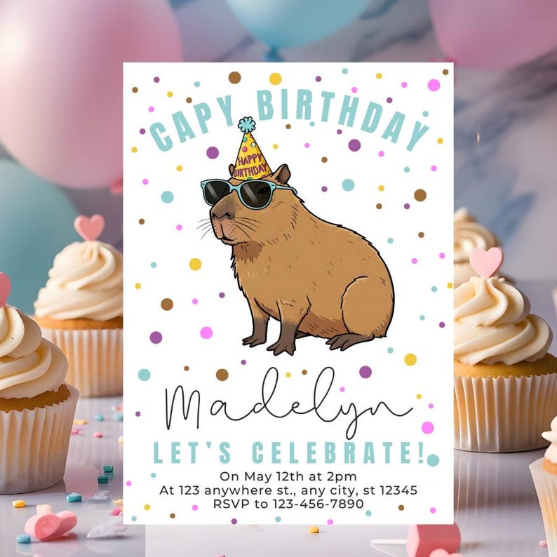May include: A birthday invitation featuring a cartoon capybara wearing sunglasses and a party hat. The text reads "CAPY BIRTHDAY" and "Madelyn LET'S CELEBRATE!" with event details. The design includes colorful confetti and cupcakes.