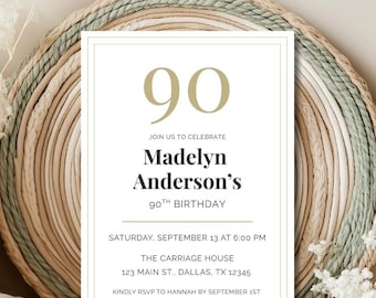 May include: A white invitation card with gold text and a gold border, announcing Madelyn Anderson's 90th birthday celebration. The card includes the date, time, and location: The Carriage House, Dallas, TX. The background features a woven circular design.