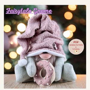 May include: A handcrafted gnome doll wearing a pink nightcap and holding a donut. The gnome has a long white beard and is wearing a light green outfit. The image includes the text "Fairytale Gnome" and a button that says "PDF Sewing Pattern & Tutorial."
