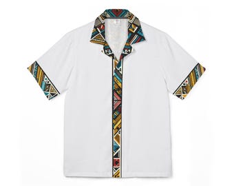 May include: White short-sleeved shirt with a colorful geometric pattern on the collar, placket, and sleeve cuffs. The pattern includes triangles and other shapes in red, yellow, blue, and black. The shirt has a classic collar.