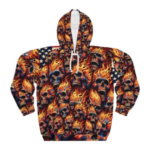 May include: A black hooded sweatshirt with a full-coverage print of skulls engulfed in flames. The flames are orange, yellow, and red. The skulls are blue and white. The background is black. The hoodie has a white drawstring and a white lining. The print includes a small American flag in the top right corner.