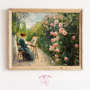 Peut inclure: Peinture encadrée représentant une femme peignant des roses dans un jardin. L'œuvre montre une femme en robe sombre assise sur une chaise en bois, peignant sur un chevalet. De luxuriantes roses roses et de la verdure entourent la scène, avec un chemin clair menant au loin.