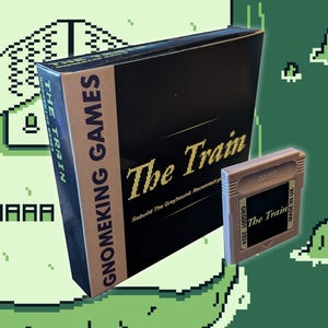 May include: A brown box with gold lettering that reads "The Train" and "Gnomeking Games". The box is next to a grey Game Boy cartridge with the text "The Train" and "GKG001 2024" on it.