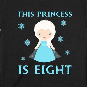 May include: Black t-shirt with a blue and white illustration of a princess with the text "This Princess is Eight" on a black background.