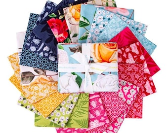 May include: A set of 16 fabric squares featuring floral and geometric patterns in shades of blue, green, pink, yellow, and red. The fabric squares are arranged in a fan shape and tied together with a white ribbon.