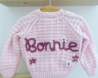 0-3 Months Personalised hand embroidered baby name cardigan. Hand knitted personalised baby cardigan.