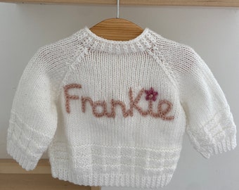 6-12 months 12-24 months 1-2 years Personalised Hand Embroidored baby name cardigans. Hand knitted personalised baby cardigans.