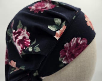 Floral Scrub Hat: Soft Stretch Knit, Elastic Back. Dark blue with assorted flowers.