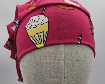 Scrub hat: Super Soft Stretch Knit, pink background with assorted soda fountain drinks