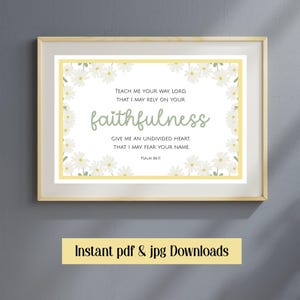 May include: A framed print with a light wood frame. The print features the word "faithfulness" in a script font, surrounded by a daisy border. Text includes a Bible verse from Psalm 86:11. The bottom of the frame has the text "Instant pdf & jpg Downloads".