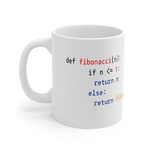May include: White ceramic mug featuring a code snippet printed on it. The code defines a function called "fibonacci" that takes an integer as input and returns the nth Fibonacci number. The code is written in Python.