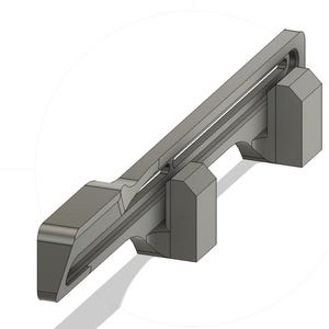 May include: A gray plastic 3D printed part with a long, thin slot running along its length. The part has two rectangular blocks on either end.