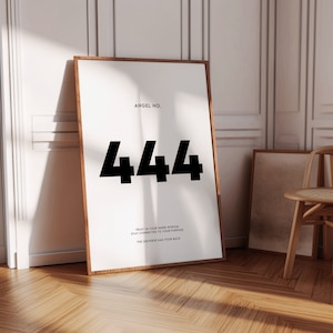 May include: A white poster with a brown wooden frame, featuring the text "ANGEL NO. 444" in black bold font. Below the number, the text reads "TRUST IN YOUR INNER WISDOM STAY CONNECTED TO YOUR PURPOSE THE UNIVERSE HAS YOUR BACK."
