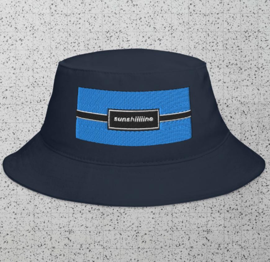 オアシス再結成ツアーのバケットハット：「Sunshiiiiine」ロゴ