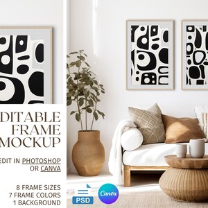 May include: Two framed abstract art prints with black and white geometric shapes on a white background. The prints are hanging on a white wall above a white couch with brown throw pillows. A wooden coffee table with a woven wicker base sits in front of the couch.