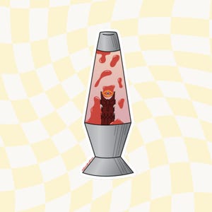 May include: A red lava lamp with a dark red tower with a single eye inside. The tower is in the center of the lamp.
