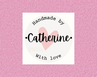 May include: White circle sticker with the text "Handmade by Catherine with love" in black lettering. A pink heart is centered in the circle.