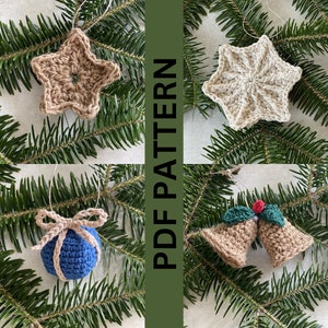 May include: Four crocheted Christmas ornaments: a brown star, a beige star, a blue ball with a brown bow, and two brown bells with green leaves and a red berry.