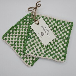 May include: Two green and white checkered woven pot holders with a tag that reads "Handcrafted by DDROCKSPHXAZ Made in the U.S.A."