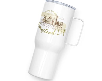 May include: White stainless steel tumbler with a handle. It features a brown illustration of a farmhouse with a windmill and the text "Living Simply Homestead Life" in gold.
