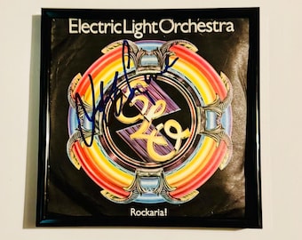 Capa avulsa autografada por Jeff Lynne, com certificado de autenticidade e moldura.