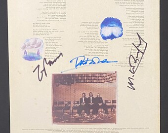Capa interna do LP autografada do Genesis com certificado de autenticidade.