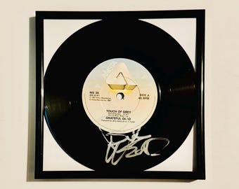 Disco de vinil autografado por Bob Weir, com certificado de autenticidade e moldura.