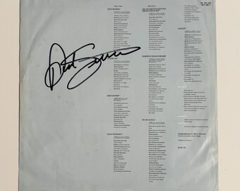 Capa interna do LP autografada por Paul Simon com certificado de autenticidade.