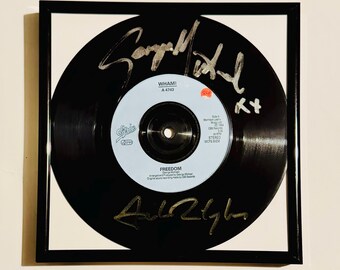 Disco de vinil autografado por George Michael Andrew Ridgeley, com certificado de autenticidade e moldura.