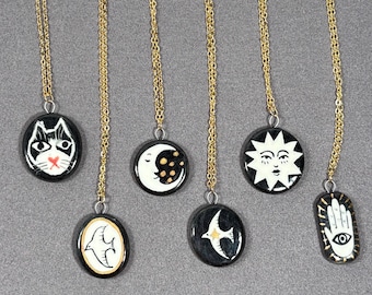 Handmade ceramic necklace, black ceramic pendant series, natural boho style, rustic nature-inspired design.