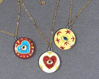 Handmade ceramic necklace, Evil Eye ceramic pendant series, natural boho style, rustic nature-inspired design.