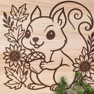 May include: A wooden carving of a cartoon squirrel holding an acorn, surrounded by sunflowers, leaves, and decorative swirls. The squirrel has a smiling expression. The design is in a dark brown colour against a light wood grain background.