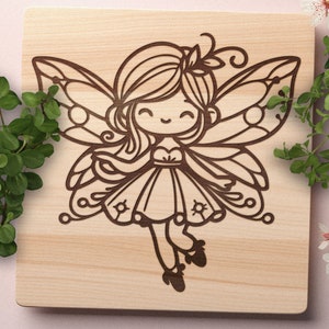 May include: A wooden cutout of a fairy with wings, a dress, and a flower in her hair. The fairy is smiling and has a whimsical expression.