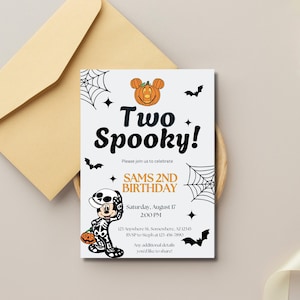 May include: A Halloween-themed invitation with the text "Two Spooky!" and "Sams 2nd Birthday." The design includes a pumpkin Mickey Mouse, bats, spiderwebs, and stars. The invitation is on a white background with a tan envelope.