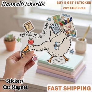 May include: A die-cut sticker featuring a white goose with an orange beak and feet. The goose carries a tote bag filled with colorful blocks, a notebook labeled IEP, and a chart. It wears an ID badge and has an apple on its head. Text reads SUPPORT IS ON THE WAY.