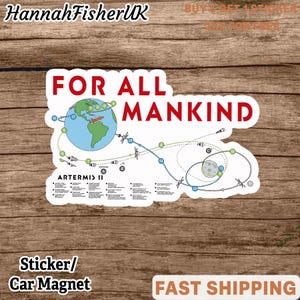 May include: A white sticker or car magnet with the text "FOR ALL MANKIND" in red. The sticker features a diagram of the Artemis II mission, with a blue and green Earth and a depiction of the moon. The sticker also includes the text "Artemis II".