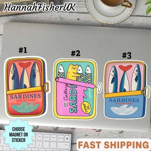 May include: Three sardine can stickers with colorful designs. One is red with blue fish, another pink with a cat, and the last blue with fish. Each can has the word "Sardines" and "salty but sweet". The text "Choose Magnet or Sticker" is also present.