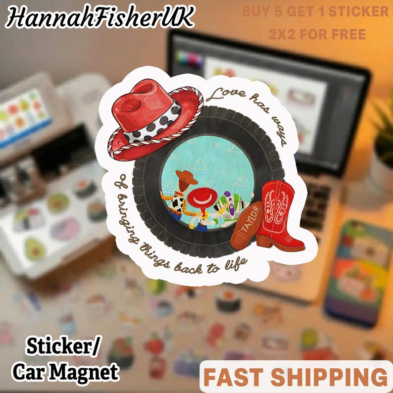 May include: A die-cut sticker featuring a black tire frame surrounding a scene with cartoon characters, a red cowboy hat, a red cowboy boot with the name Taylor, and the text Love has ways of bringing things back to life in brown script.