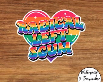 May include: A sticker with a heart-shaped design featuring the text "RADICAL LEFT SCUM" in rainbow colors. The sticker has a white border and is set against a wooden background. Additional text indicates it is waterproof and dishwasher safe.