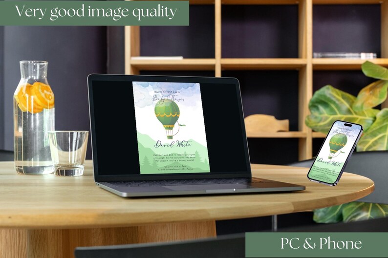 May include: A laptop and smartphone display a green hot air balloon invitation design. The laptop is open on a wooden table, with a glass of water and a bottle of water with orange slices. The text "Very good image quality" and "PC & Phone" are also visible.