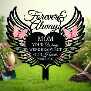 May include: Black metal garden stake with wings and a heart. The heart has the text "Mom Your Wings Were Ready But Our Hearts Were Not" and is surrounded by colorful butterflies.