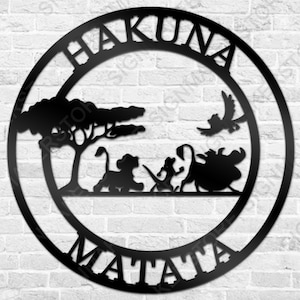 May include: Black metal wall decor featuring a circle with the words "Hakuna Matata" and a silhouette of a lion, a monkey, and a bird in a tree.
