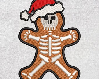 Pode incluir: Homem de gengibre bordado com um design de esqueleto usando um chapéu de Papai Noel vermelho e branco. O homem de gengibre é marrom com um contorno preto e detalhes de esqueleto brancos. Uma decoração de feriado única.