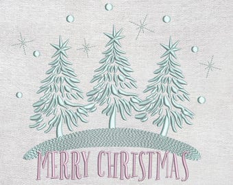 May include: Embroidered design featuring three stylized Christmas trees in light blue, set on a small hill, with snowflakes and circles. The words "MERRY CHRISTMAS" are embroidered in pink below the trees, all on a textured white background.